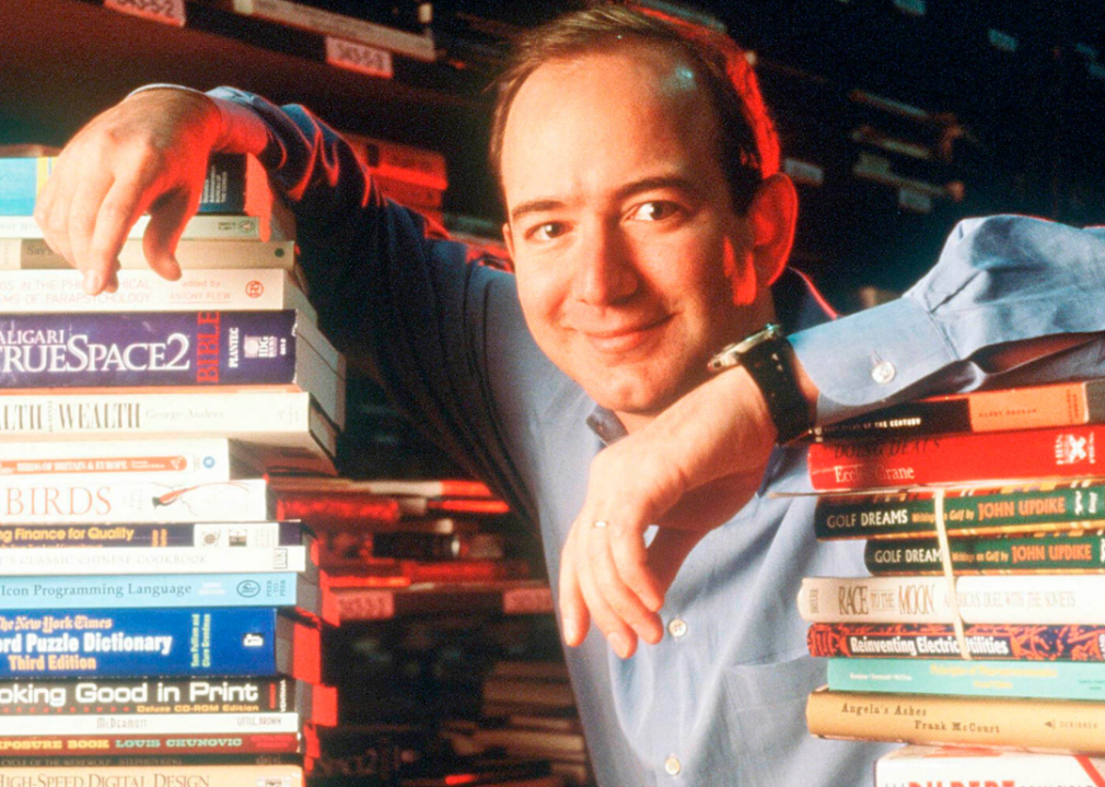Jeff Bezos poses with books