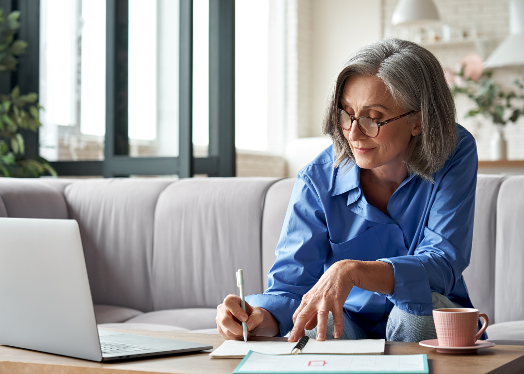 Mature woman using laptop.