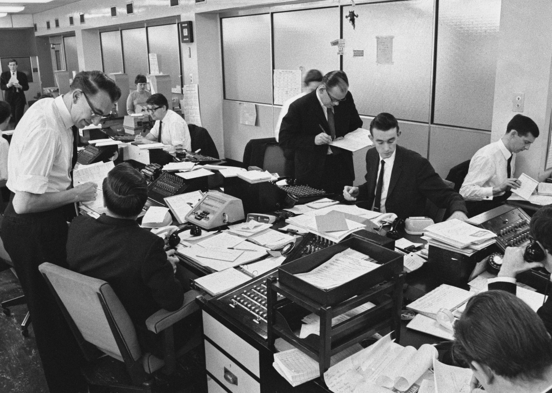 A group of bankers processing transactions