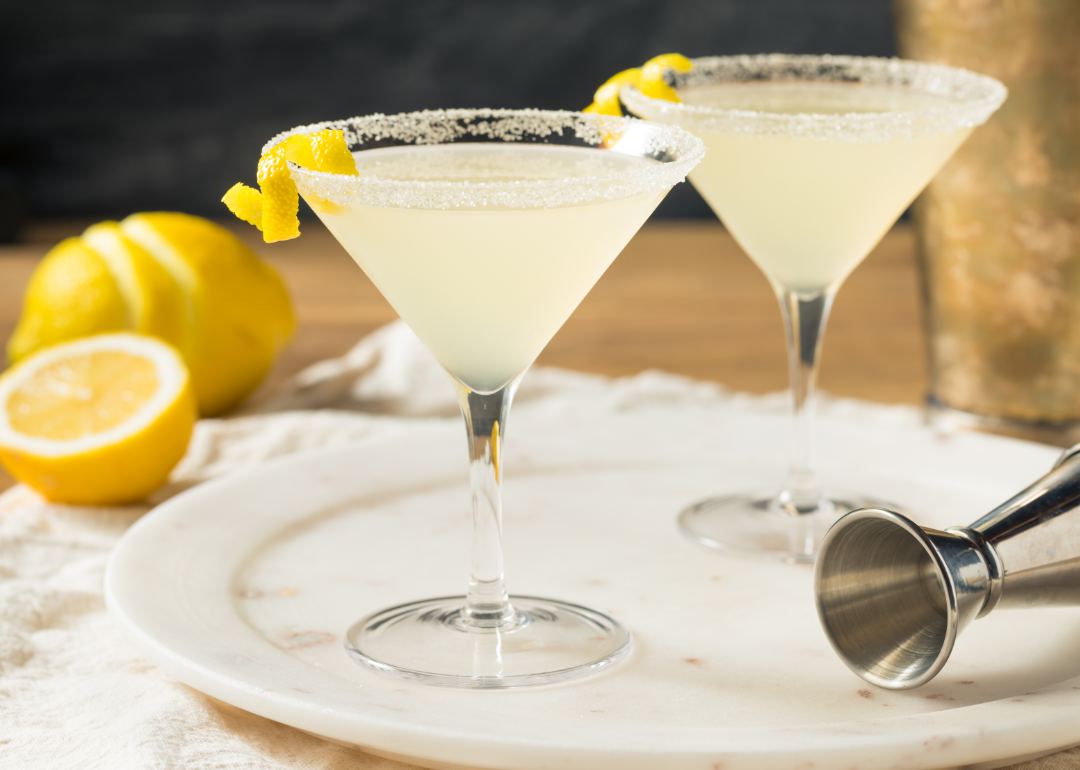 Two lemon martinis on plate.
