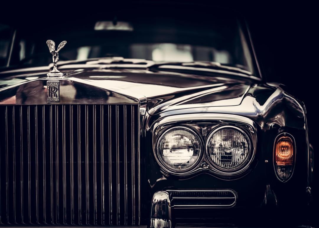 Cropped close up of a black Rolls Royce.