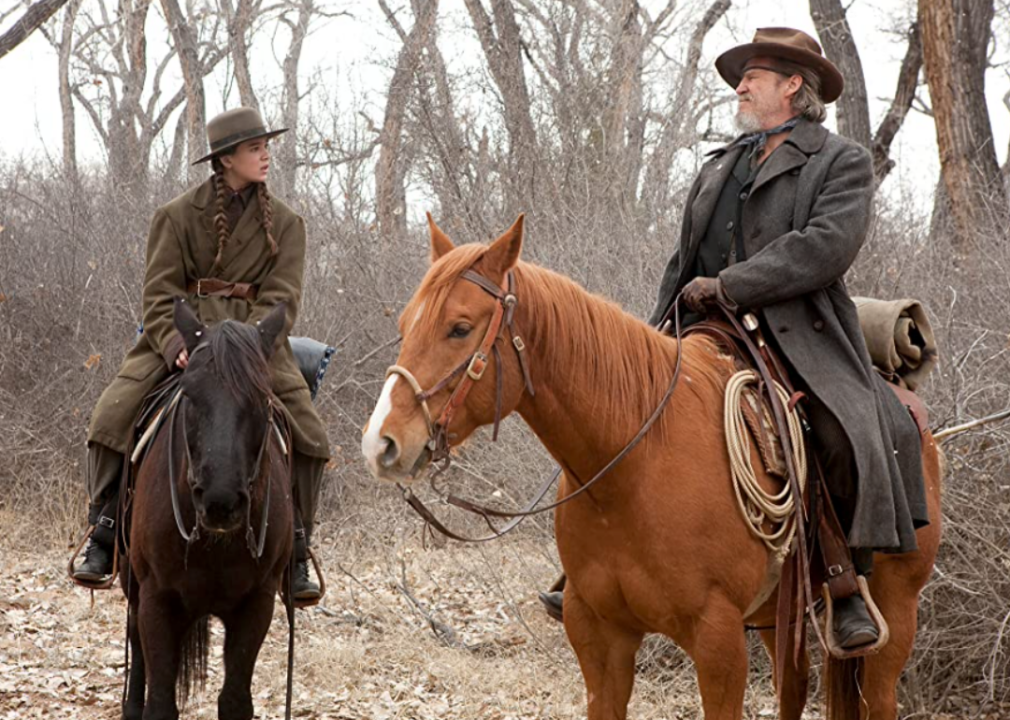 Jeff Bridges and Hailee Steinfeld on horseback in a scene from ‘True Grit’