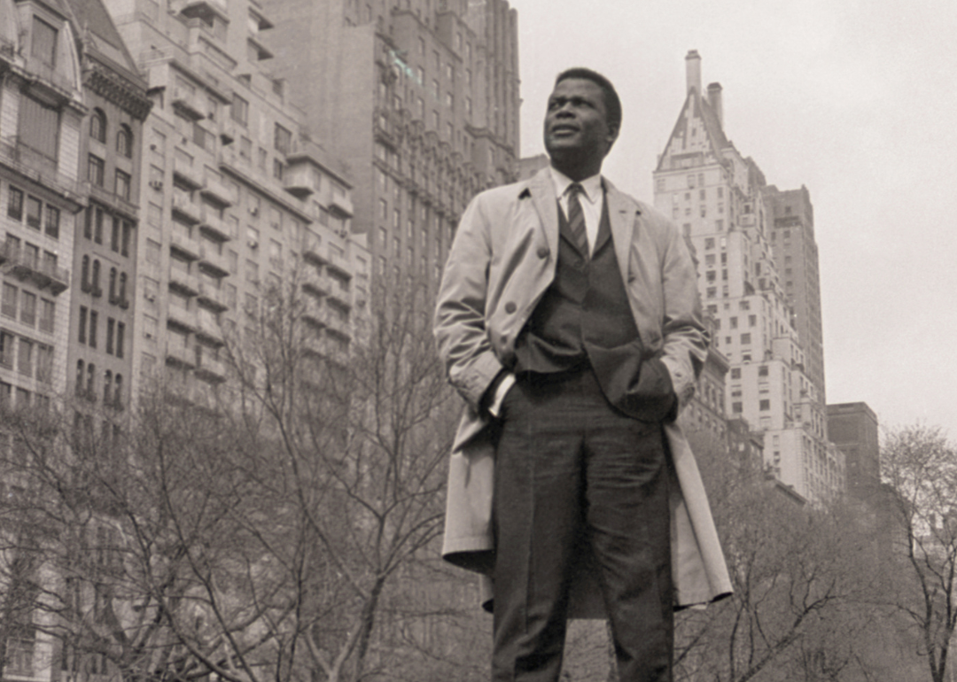 Sidney Poitier against a backdrop of New York apartment buildings.