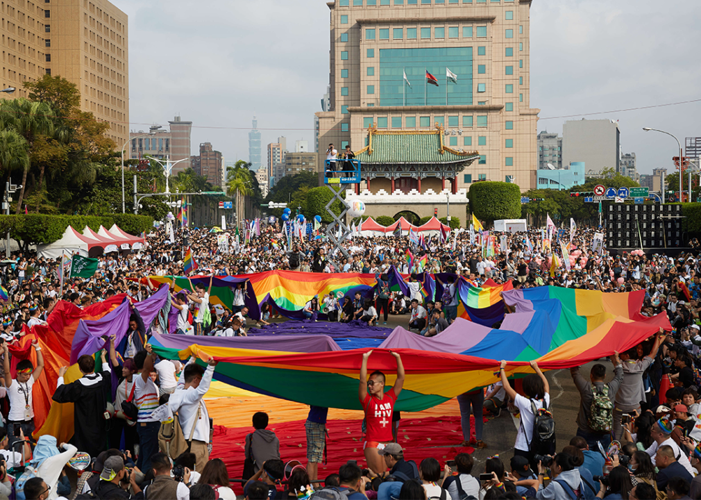 People carry rainbow flags at the start of the Taiwan Pride parade on Ketagalan Boulevard in Taipei.