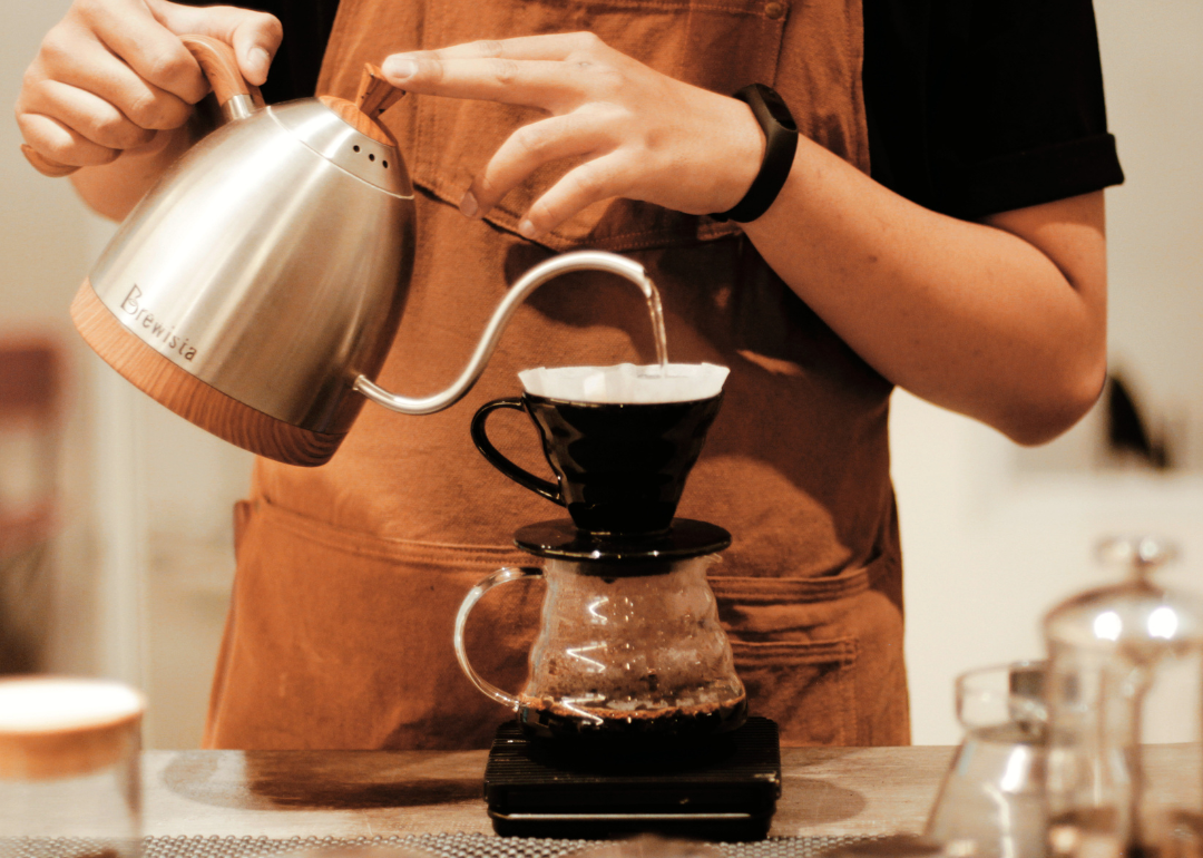 Barista preparing drip coffee.