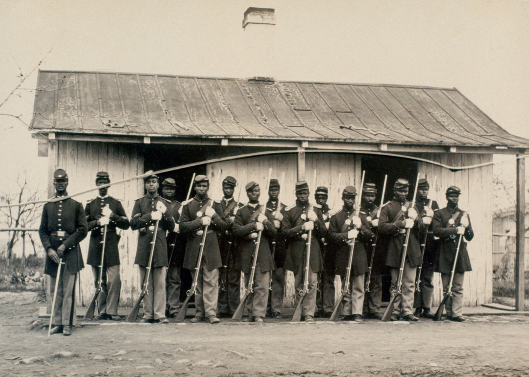 107th USCT pose outside a guard house at Fort Corcoran.