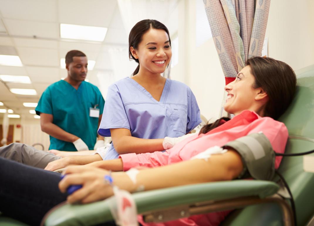 Person making a blood donation in hospital.