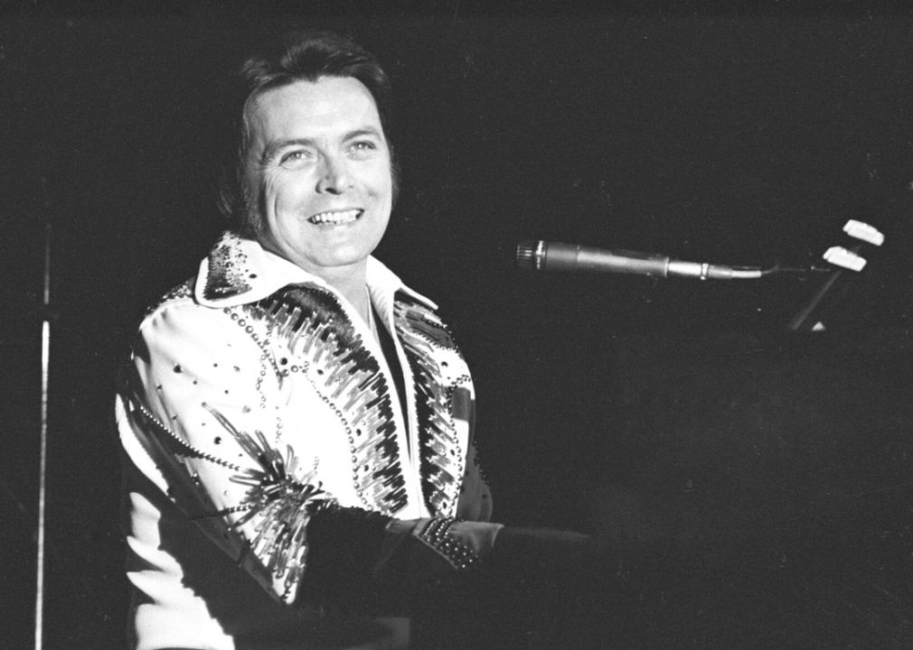 Mickey Gilley performing at piano.