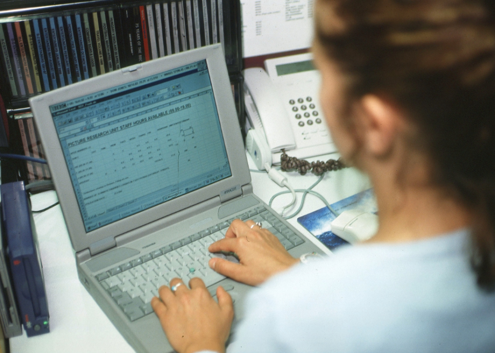 Woman typing on laptop computer