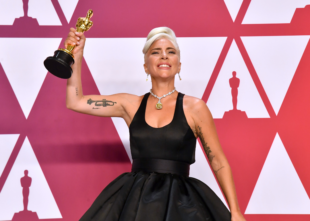 Lady Gaga poses with Academy Award.