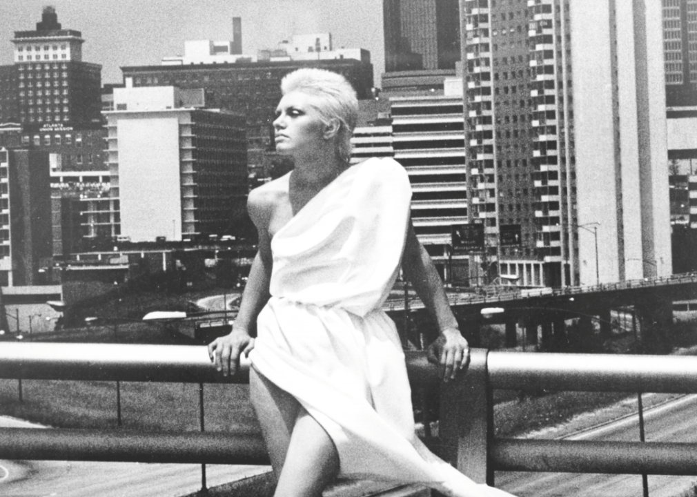 Alicia Bridges posed with city buildings