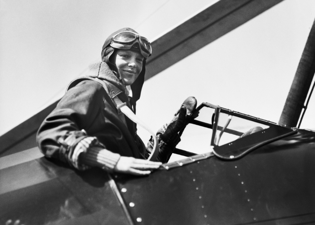 Amelia Earhart seated in cockpit of her plane