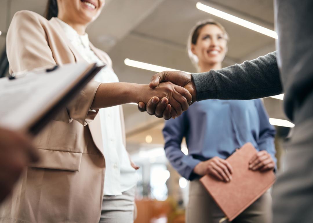 Closeup handshake in office.