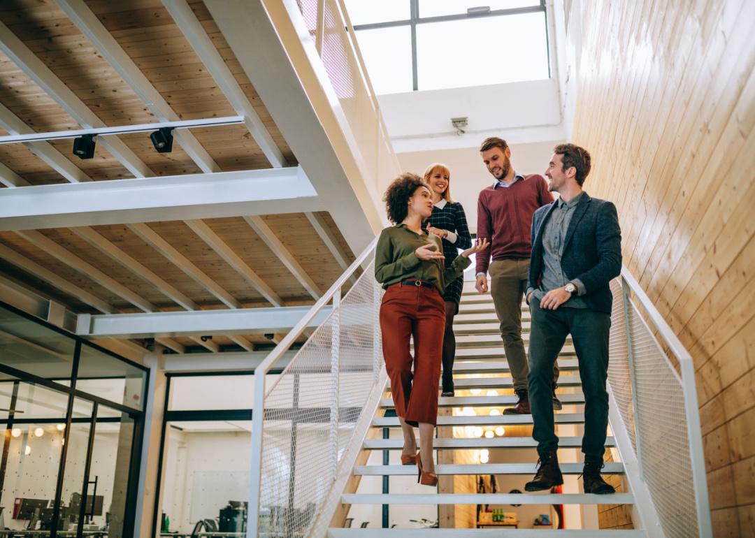 Group of coworkers going down the stairs.