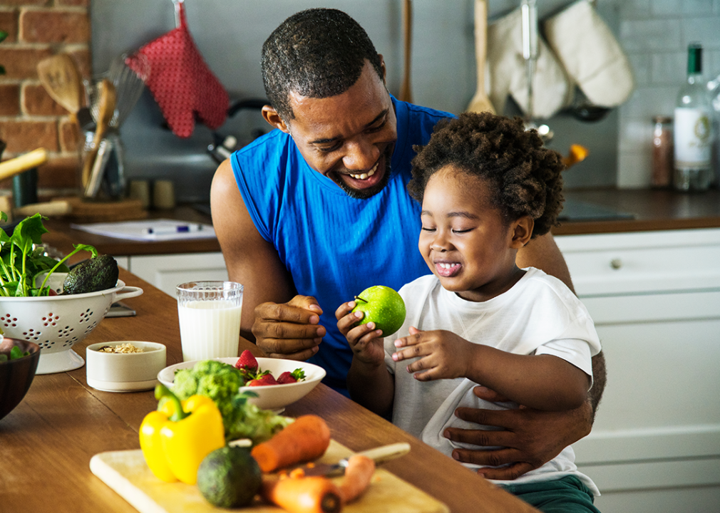 Father and son preparing a meal together.