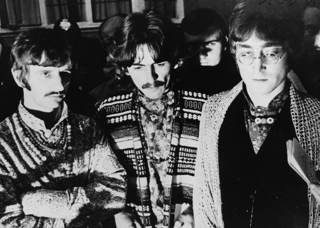 Ringo Starr, George Harrison, John Lennon speak to the press.