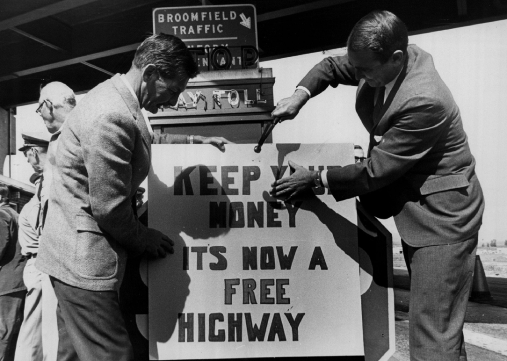 Men changing Colorado toll sign to ‘free highway’