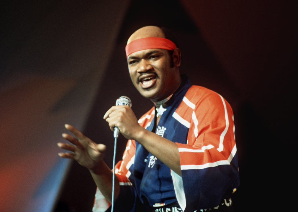 Carl Douglas performs on stage.