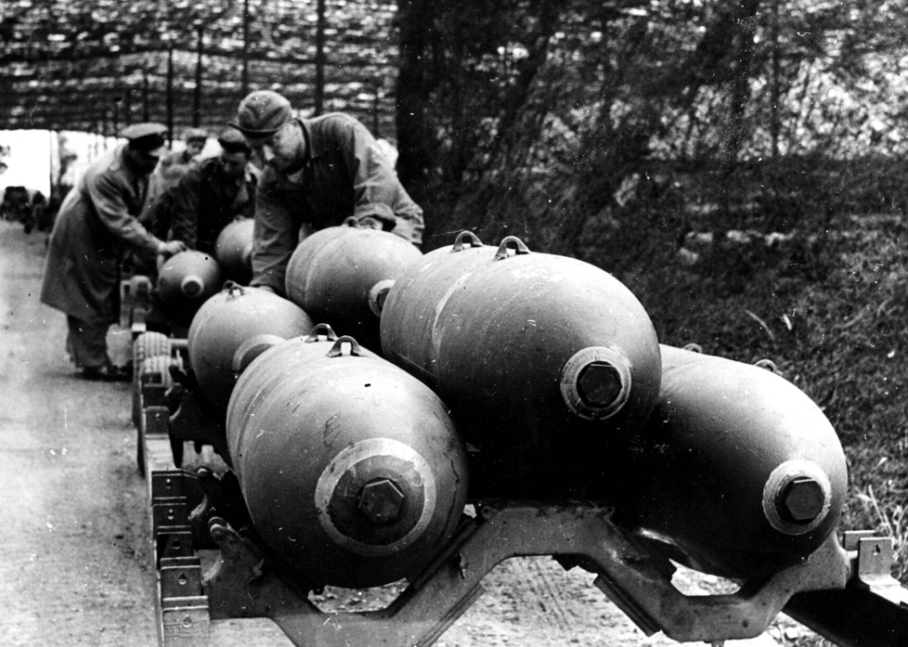Soldiers load 2,000-pound bombs on aircraft in England prior to D-Day.