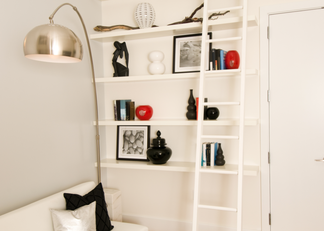 Modern white shelving mounted to wall.