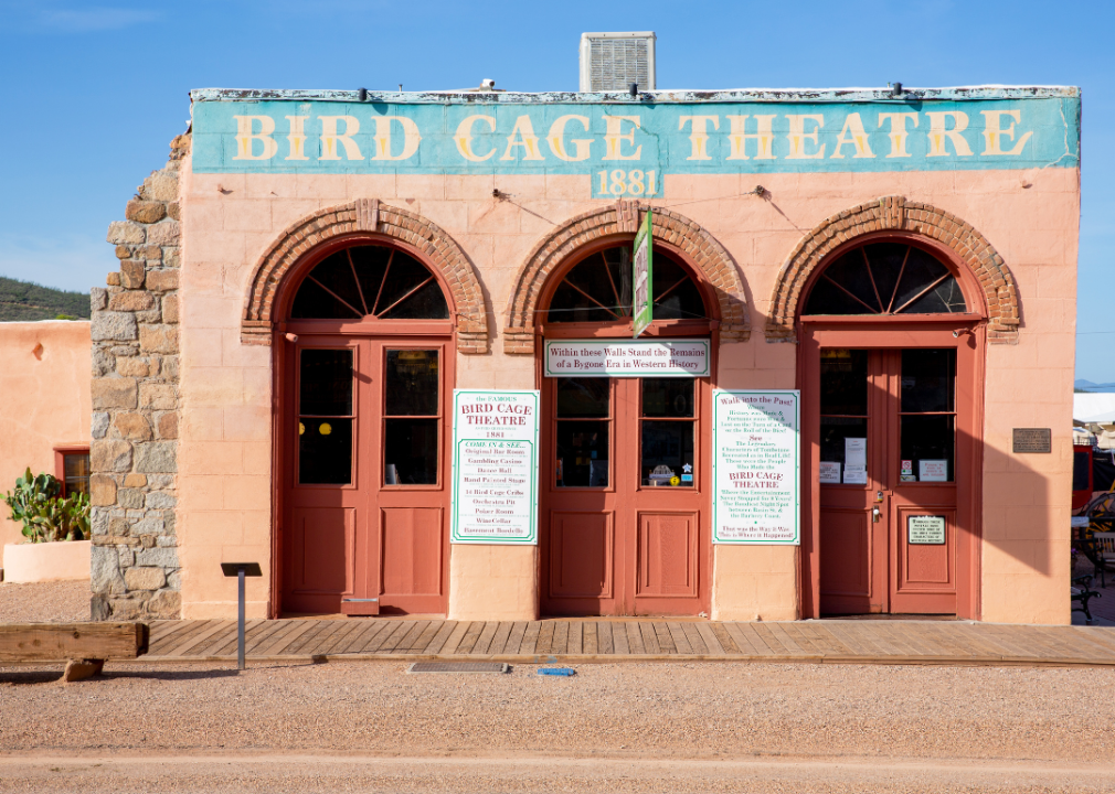 Exterior one story building with Bird Cage Theatre painted on the facade.
