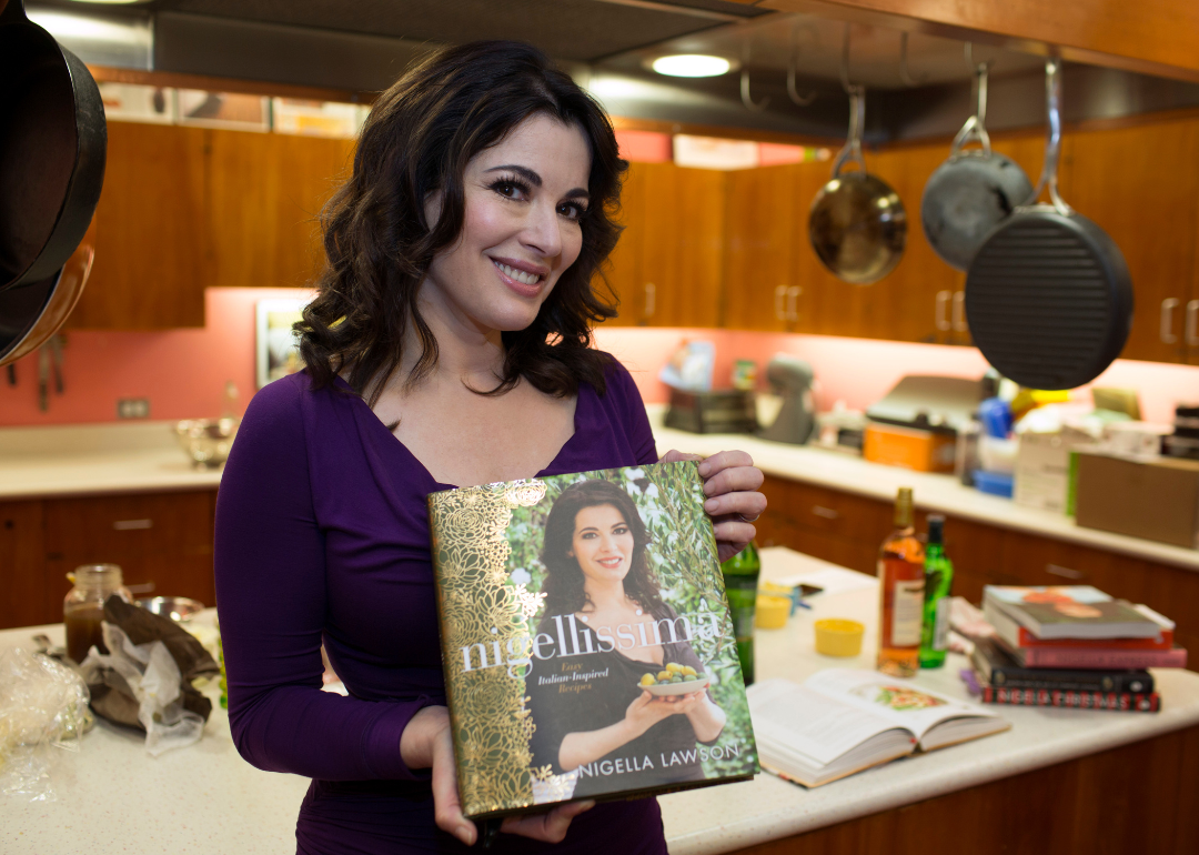 Nigella Lawson poses with book.