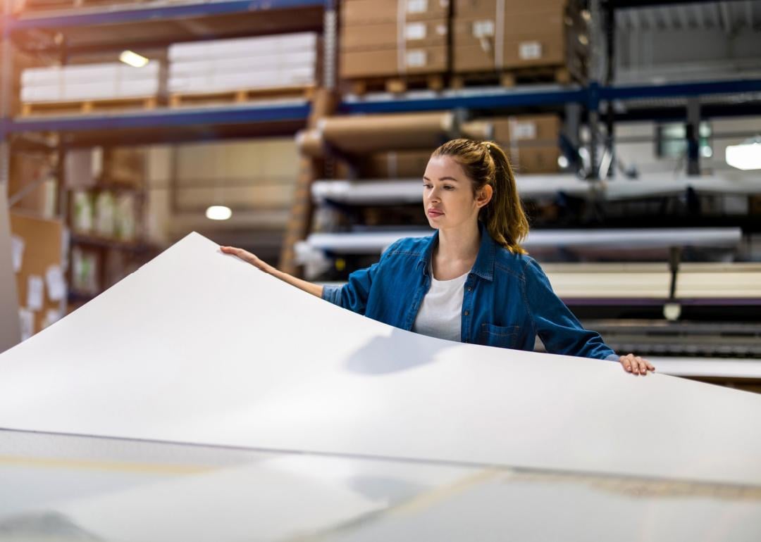 Woman working in printing factory.