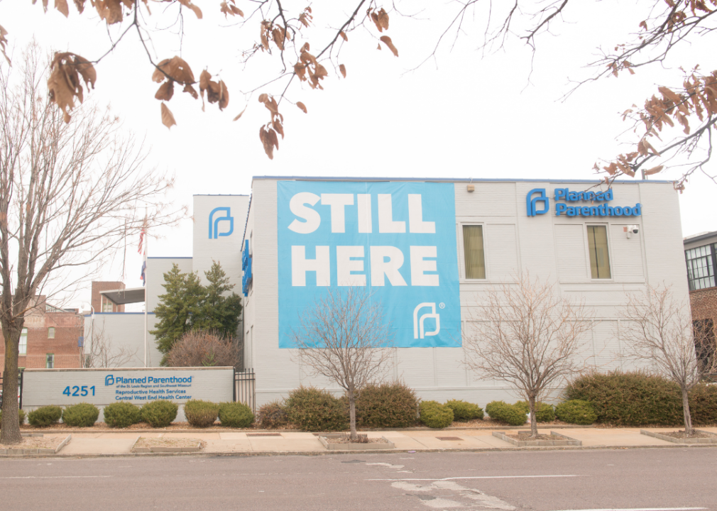 Exterior of Missouri Planned Parenthood building with a large ‘Still Here’ banner
