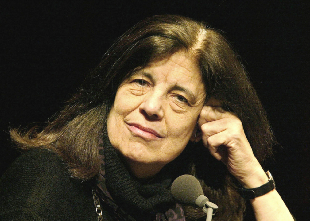 Susan Sontag portrait seated with microphone