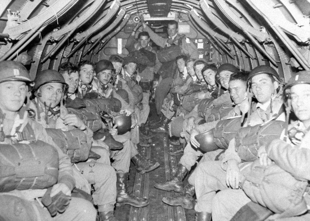 A U.S. infantry paratroop regiment is shown inside a C-47 transport in England in the early hours of June 6, 1944.