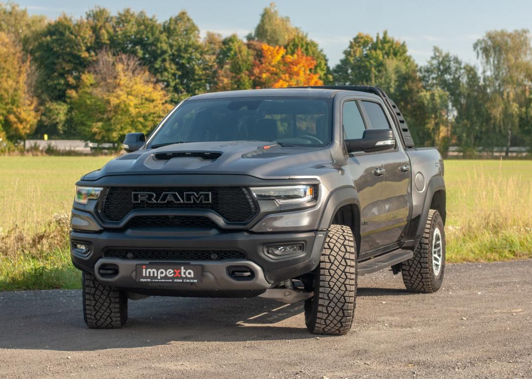 Charcoal Grey Ram Pickup parked on dirt road