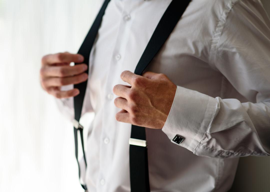 Man holding suspenders