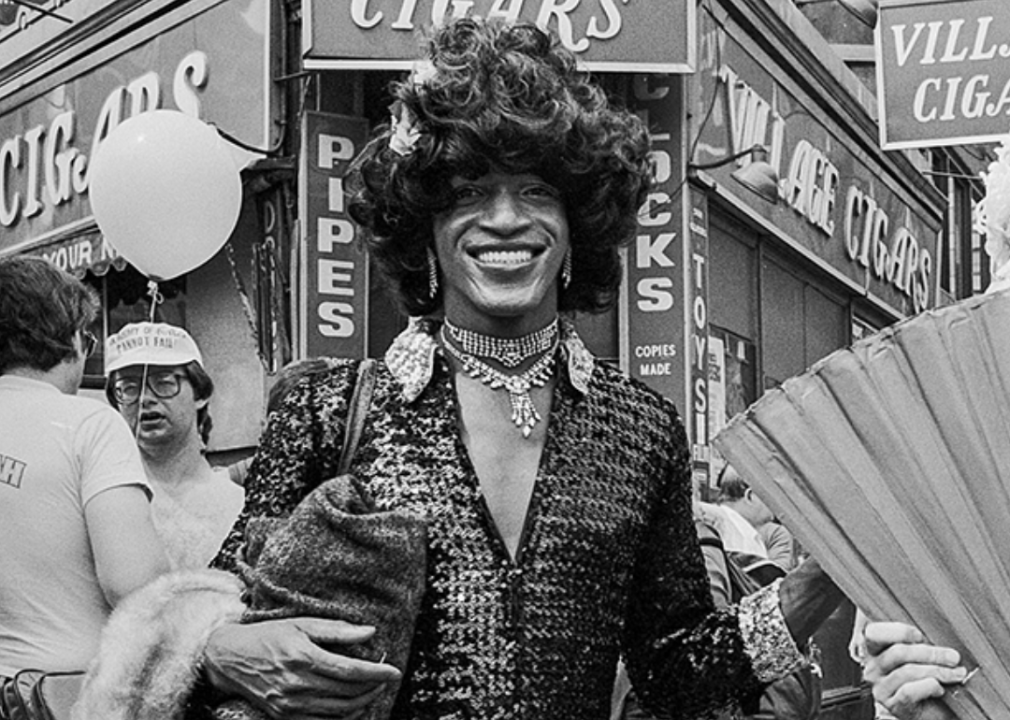 Marsha P. Johnson smiles for a photographer during the 1982 Pride March in New York City.