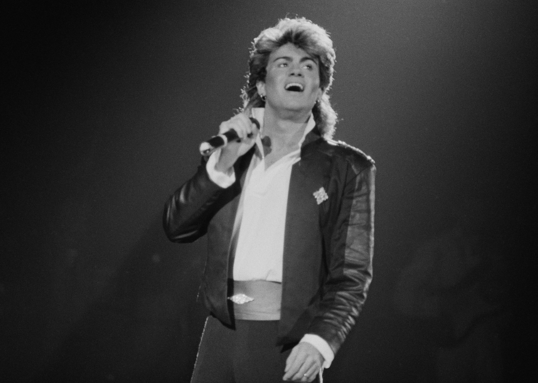 George Michael performing on stage.