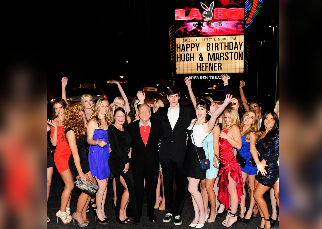 Hugh Hefner and Marston Hefner pose with crowd as they celebrate Hugh Hefner's 85th birthday