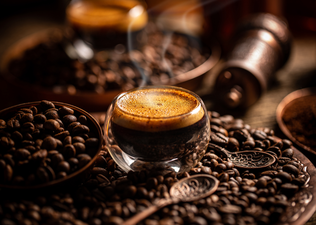 Small coffee glass with beans and spoons.