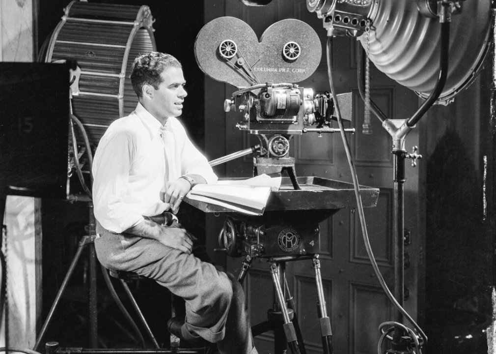 Director Frank Capra on film set behind camera
