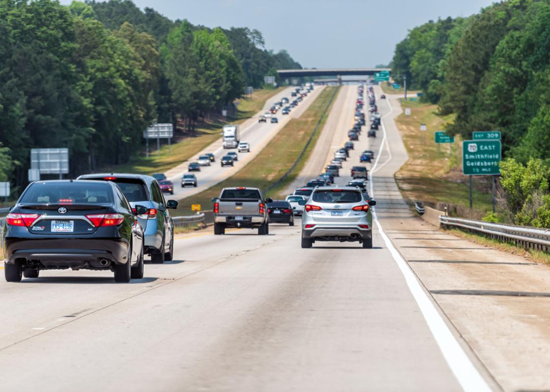 Highway with traffic near Raleigh with exit sign to 70 East Smithfield.