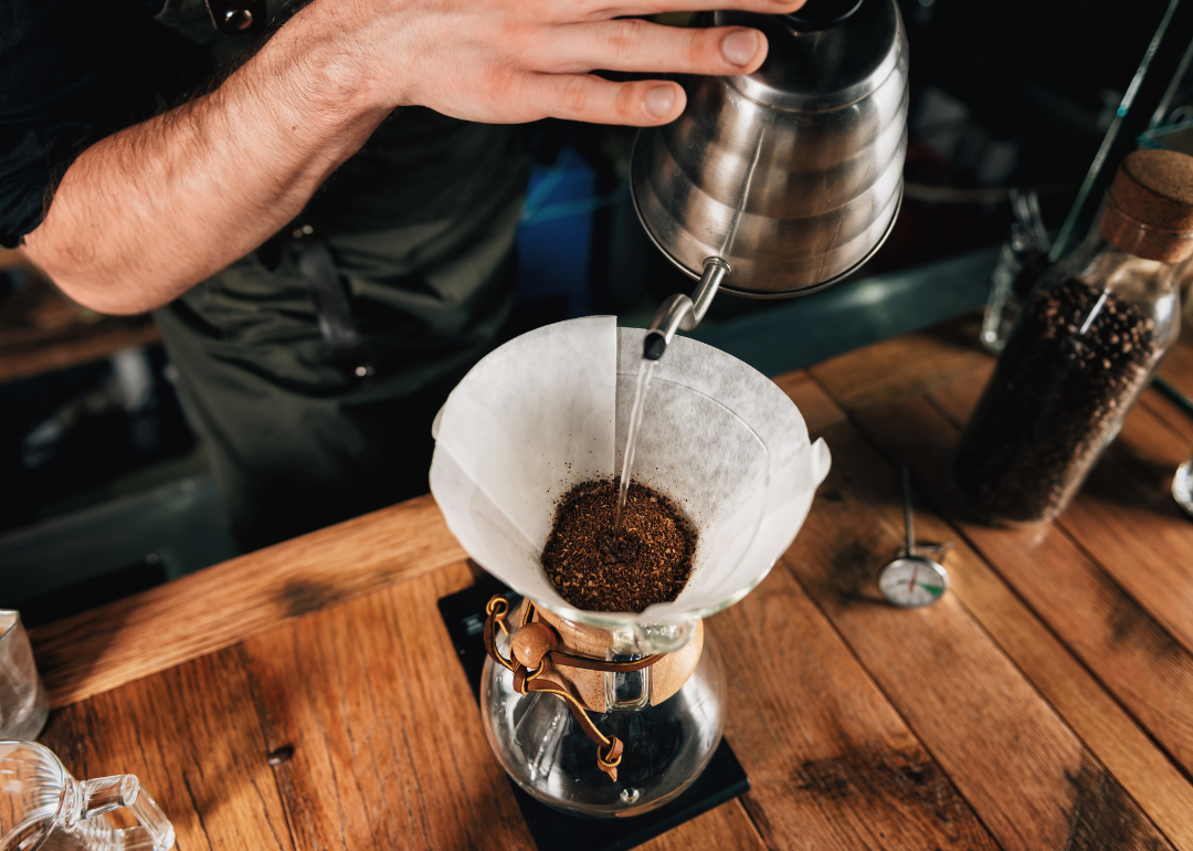 Barista preparing drip coffee.