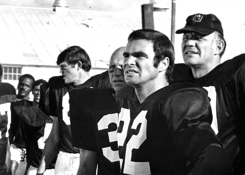 Burt Reynolds on the sideline in a scene from the film 