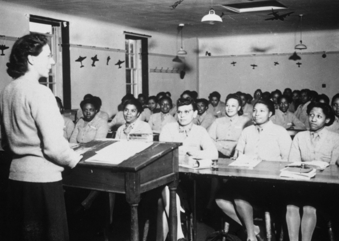 United States Army nurses during a lecture in a classroom.