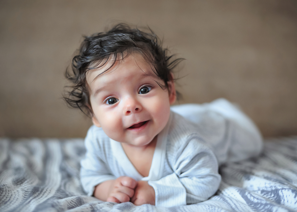 Four month old baby portrait looking at camera.