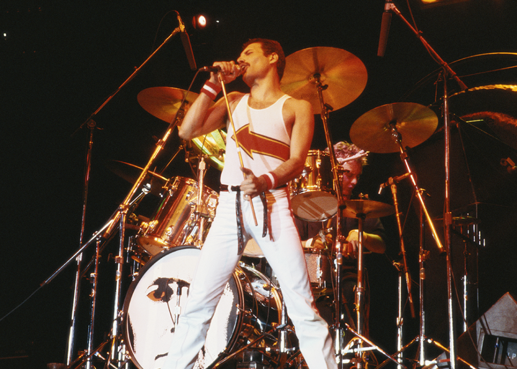 Freddie Mercury with Queen performing in concert.