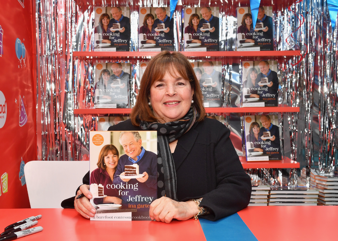 Ina Garten signs cookbooks at promotional event.