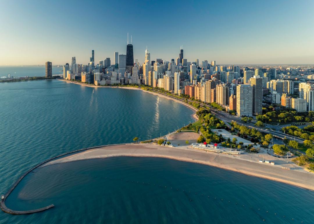 Aerial view of Chicago downtown skyline with park and beach.