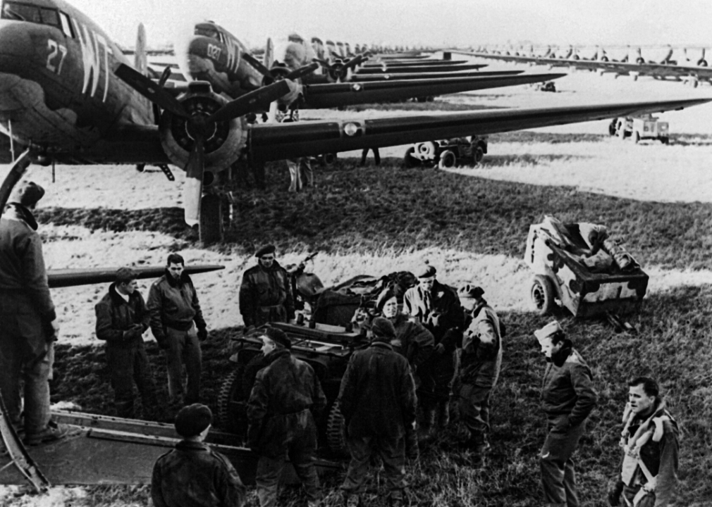 Allied aircrews work around C-47 transport planes shortly before D-Day.