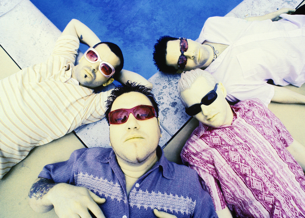 Kevin Coleman,Steven Harwell, Greg Camp, and Paul De Lisle pose for an overhead portrait by pool.