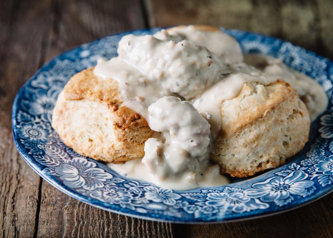 Biscuits and gravy on blue vintage plate.