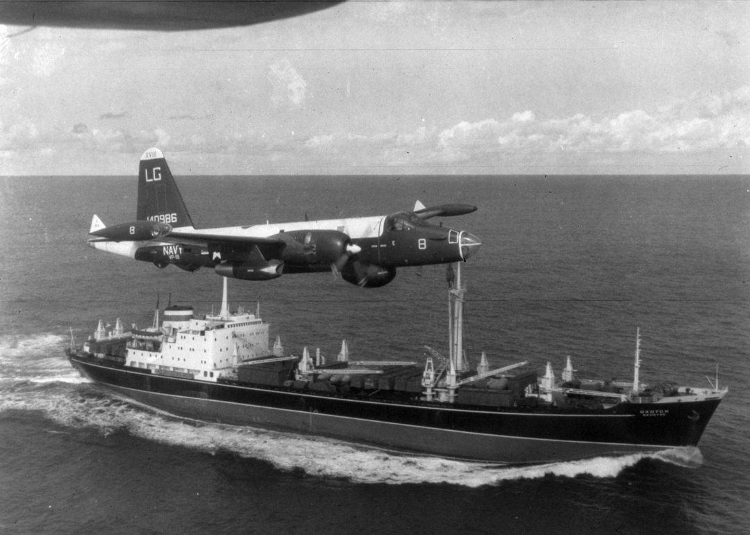 A US patrol plane flies over a Soviet freighter during Cuban missile crisis.