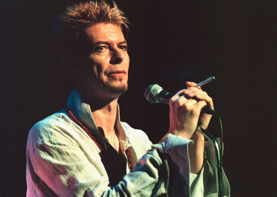 David Bowie performs onstage.